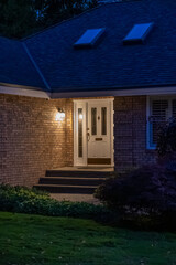 Entrance of luxury house with nice green Summer landscape at night in Vancouver, Canada, North America. August 2025