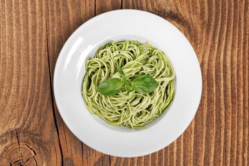 Tasty Spaghetti noodles dish with Sauce and Basil