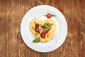 Tasty Spaghetti noodles dish with Sauce and Basil