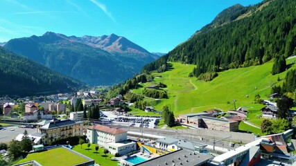 Aerial view scenic alpine town Bad Gastein in Austria with famous waterfall, ski lifts, spa hotels and wellness centers, combining nature, adventure, skiing and relaxation in the Salzburg Alps