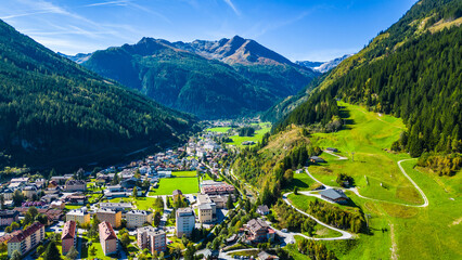 Aerial view scenic alpine town Bad Gastein in Austria with famous waterfall, ski lifts, spa hotels and wellness centers, combining nature, adventure, skiing and relaxation in the Salzburg Alps © Viktor