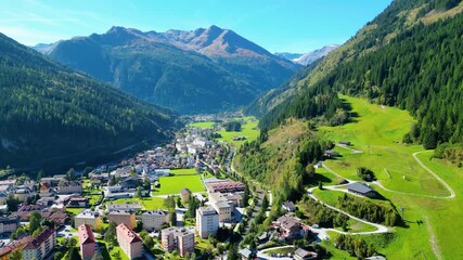 Aerial view scenic alpine town Bad Gastein in Austria with famous waterfall, ski lifts, spa hotels and wellness centers, combining nature, adventure, skiing and relaxation in the Salzburg Alps