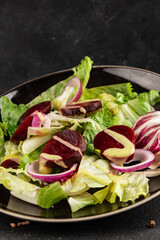 Beet salad green leaf lettuce vegetables natural product tasty snack fresh delicious gourmet food background on the table rustic top view copy space keto and paleo diet vegan and vegan food