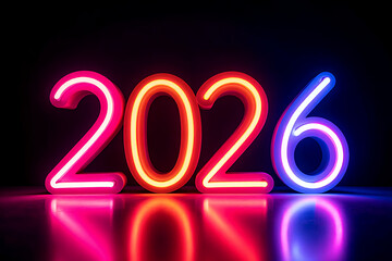 New Year 2026 greeting features numbers spell "2026" made from glowing LED neon light in pink, orange, red and purple standing on a black reflective surface