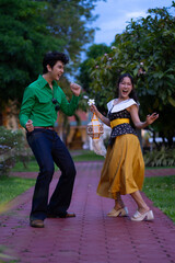 Dancing couple colorful outfits enjoying lively moment
