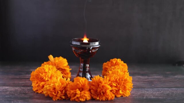 Mexican offering with burning and smoky incense called "Incienso de copal" on altar for Celebration of Mexico's Day of the Dead in Latin America