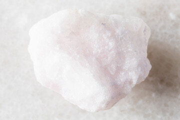 sample of raw pink aragonite mineral on white