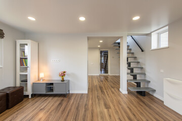 Modern Home Minimalistic Living Room With Wooden Flooring and Open Staircase
