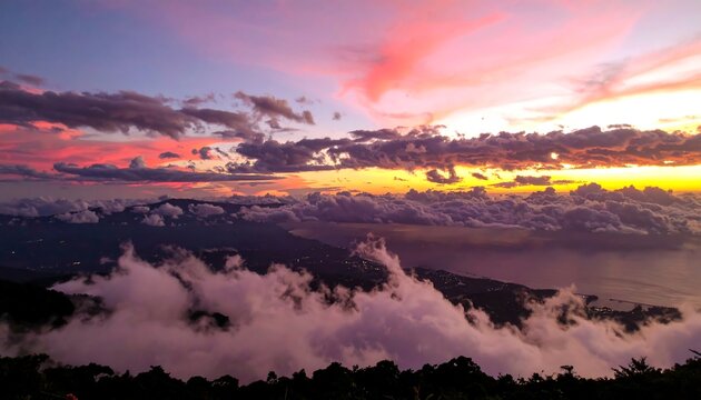 Majestic sunset over a mountain range shrouded in clouds - Powered by Adobe