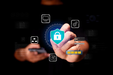 A hand holding a smartphone with digital security icons representing cybersecurity and data protection in a dark background.