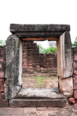 Phimai Historical Park, ancient rectangular complex of temples features intricate carvings & stone sculptures at Phimai District, Nakhon Ratchasima Province, Thailand. Vertical.