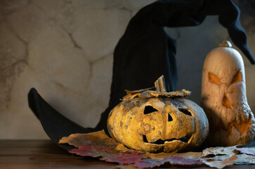 Halloween scene with pumpkins and witch's hat