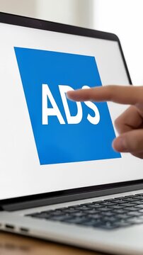 Understanding Online Advertising: A Close-Up Look at Clicking 'ADS' on a Laptop &ndash; Explore Digital Marketing Strategies and Tactics