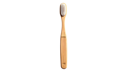 A light brown wooden toothbrush with a light gray bristle head