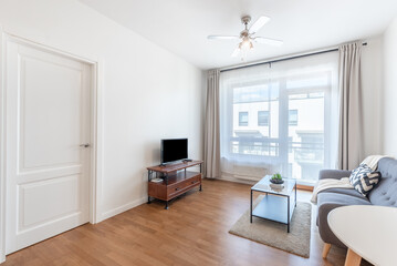 Modern Minimalist Living Room with Cozy Decor and Natural Light