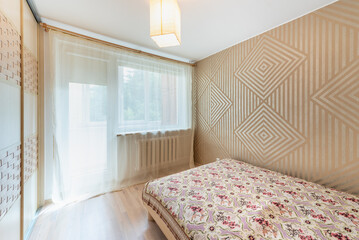 Cozy Bedroom with Decorative Wall Panels and Natural Light Through Curtains
