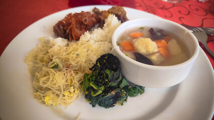 Plate of Rice Noodles Soup and Fried Chicken