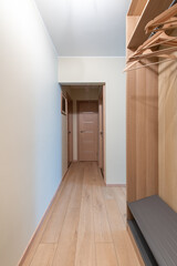 Modern Entryway with Wooden Door and Elegant Interior Design Elements