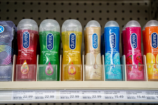 View of Durex lubricant and massage gel bottles on pharmacy shelf. Toronto, Canada - September 20, 2025.