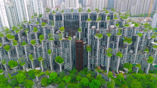 Aerial of the Tian An 1000 Trees building, a terraced architectural complex with numerous trees, in Shanghai, China.