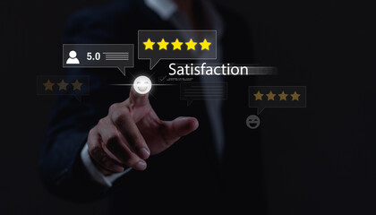 Businessman touching virtual smiley face and five-star rating icon, representing customer...