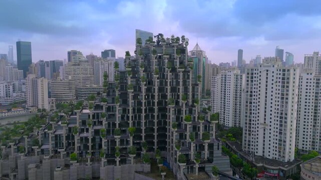 Aerial view of the '1000 Trees' architectural complex, a unique terraced building adorned with plants, surrounded by a modern cityscape in Shanghai, China.