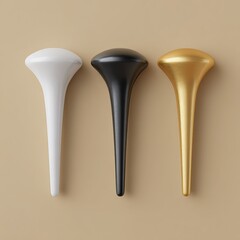 Three decorative metallic objects in white black and gold