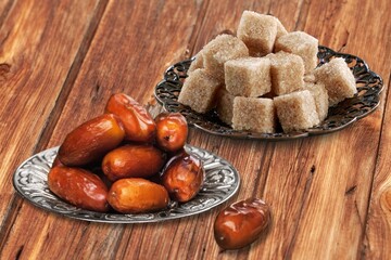 Ramadan concept, sugar in muslim bronze plate