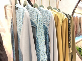 A collection of Muslim clothing for women with various designs, patterns and colors is sold in a clothing shop.