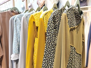 A collection of Muslim clothing for women with various designs, patterns and colors is sold in a clothing shop.