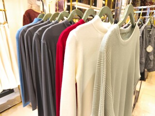 A collection of Muslim clothing for women with various designs, patterns and colors is sold in a clothing shop.