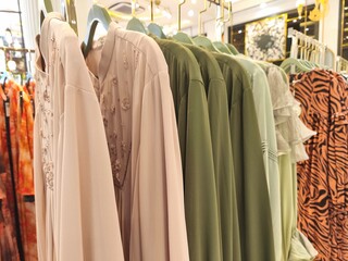 A collection of Muslim clothing for women with various designs, patterns and colors is sold in a clothing shop.