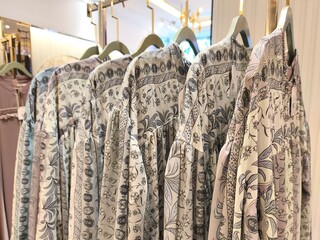 A collection of Muslim clothing for women with various designs, patterns and colors is sold in a clothing shop.