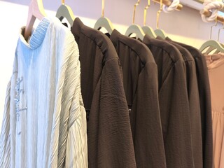 A collection of Muslim clothing for women with various designs, patterns and colors is sold in a clothing shop.