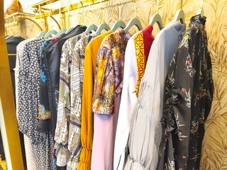 A collection of Muslim clothing for women with various designs, patterns and colors is sold in a clothing shop.