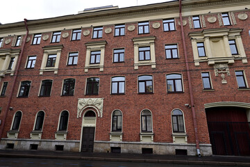An old red brick building in Saint Petersburg on Romenskaya Street.