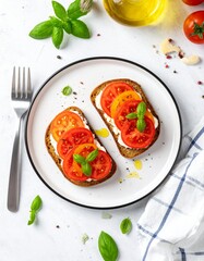 Top-down view of whole grain toast with ricotta, sliced tomatoes, olive oil, black pepper, basil garnish on white plate over marble. Bright, fresh, clean breakfast scene.