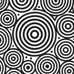 Abstract black and white concentric circles pattern with small dots