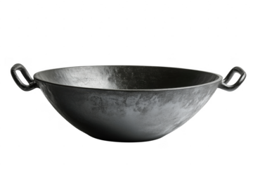 High angle studio shot of a rustic black wok on a plain transparent background