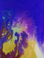 abstract background of acrylic paint in blue, yellow and purple colors