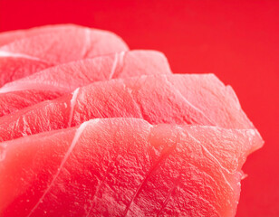 Close up sashimi with tuna on a clean red studio background AI