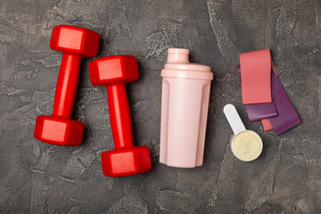 Protein shake with protein powder on a colored background. The powder is mixed with water or milk. A dietary supplement for a balanced diet. Whey protein. Fitness and gym diet nutrition.