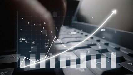 A close-up of hands typing on a keyboard, set against a backdrop of digital financial graphs and...