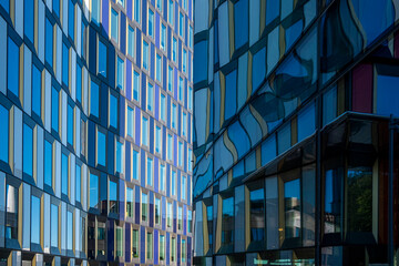 Glass façades of Stockholm office complex with vertical and horizontal rhythm, Scandinavian architecture reflecting clarity, perspective, geometry and modern design for visual creativity