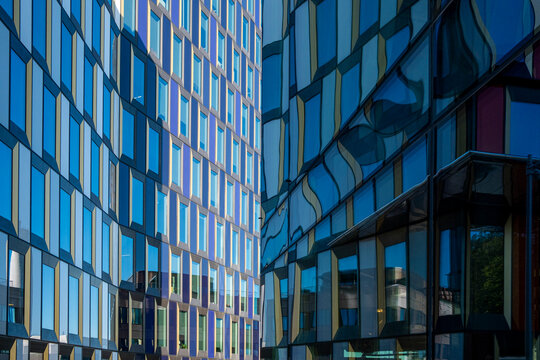 Glass façades of Stockholm office complex with vertical and horizontal rhythm, Scandinavian architecture reflecting clarity, perspective, geometry and modern design for visual creativity