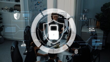 A business team engages in a collaborative meeting while a digital security interface overlays the...