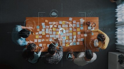 A diverse group of individuals collaborates around a table filled with sticky notes, depicting a dynamic brainstorming session enhanced by digital technology visualizations. Raster
