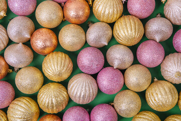 Christmas background of colorful shiny balls on a Christmas tree with space for greetings, offers, advertisements, and sales. New Year and Christmas greeting card. Flat lay, copy space