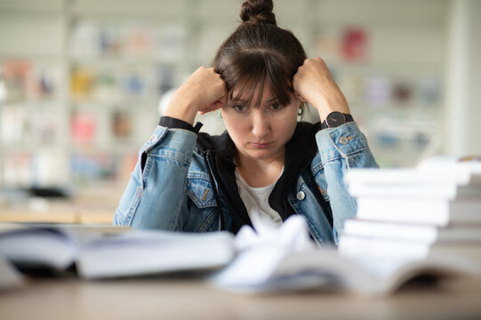 Stressed student in library