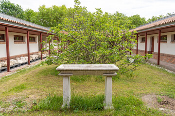 Inner courtyard of an ancient Roman villa with an old stone domestic altar